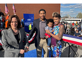 William Griffin poses with his wife and child next to Vice President Kamala Harris
